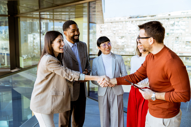 Professionals meeting and shaking hands